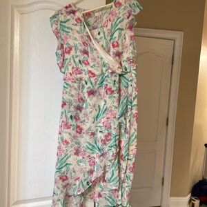 A New Day flowered wrap around dress. Hits above the knee